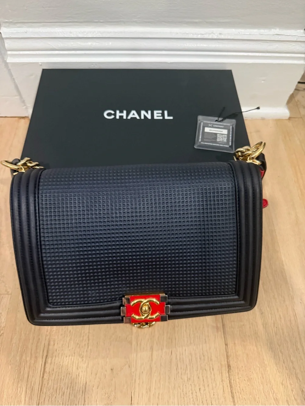 Authentic Chanel Navy Quilted Medium Boy Bag with Red & Gold Accent